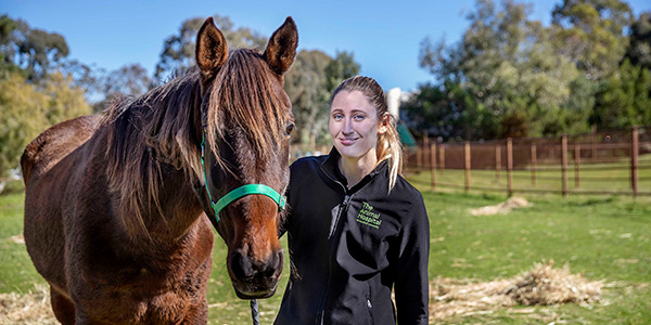 Vet student with horse