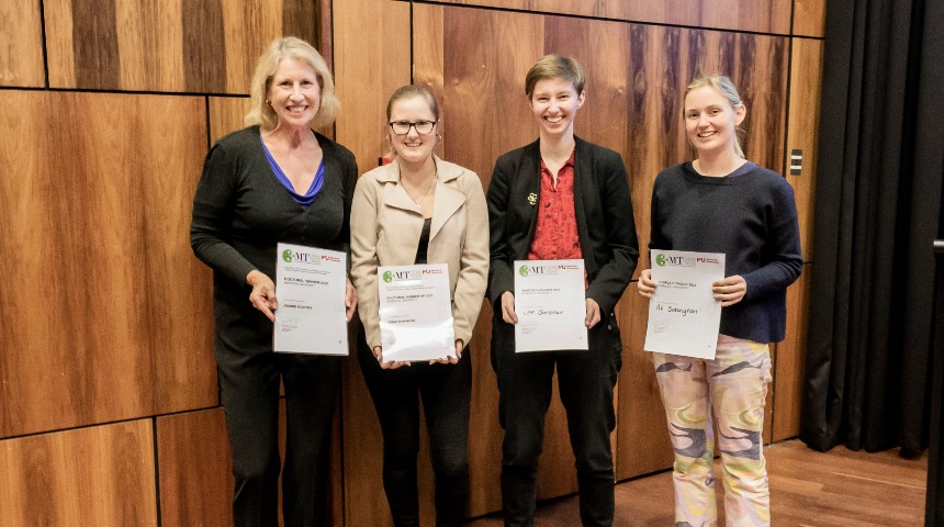 Joanne Scotney, Tenaya Duncan, Lee Barbour and Ali Babington lined up inside Kim Beasley Lecture Theatre at Murdoch University holding their winners certificates with big smiles