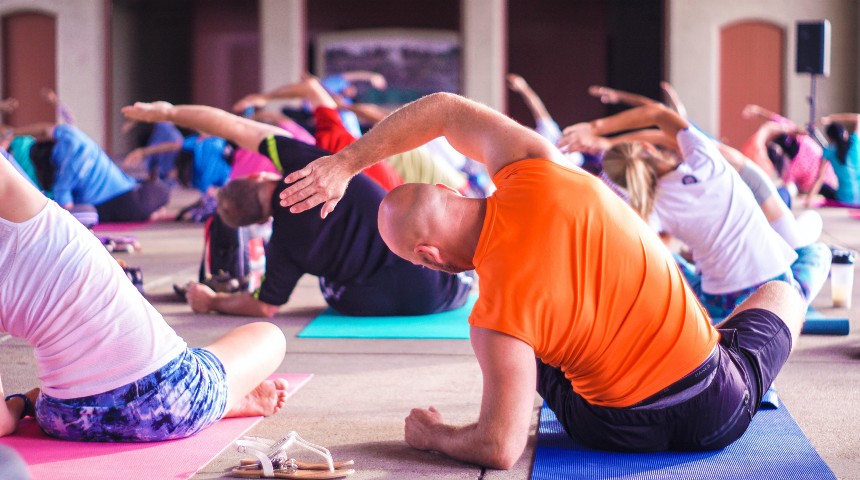 Adults taking part in yoga class.