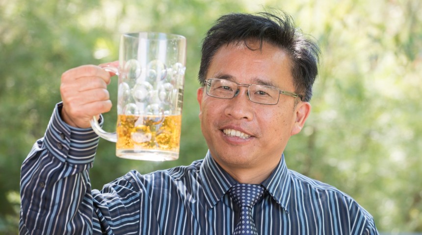 Professor Chengdao Li holding a beer