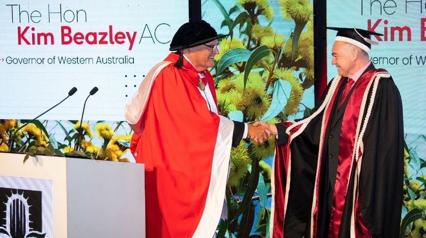 Governor of Western Australia Kim Beazley AC shakes the hand of Murdoch University Vice Chancellor Professor Andrew Deeks, both in full academic regalia
