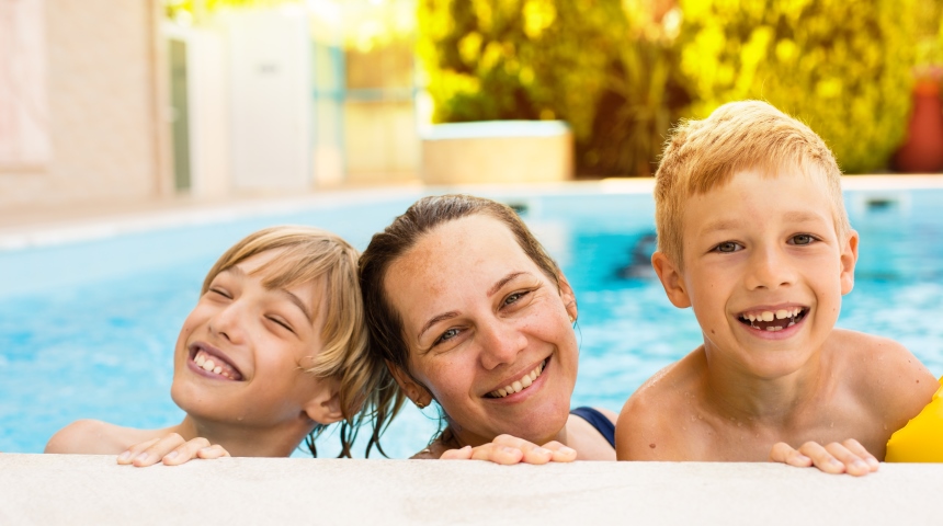 mother and two sons in swimming pool