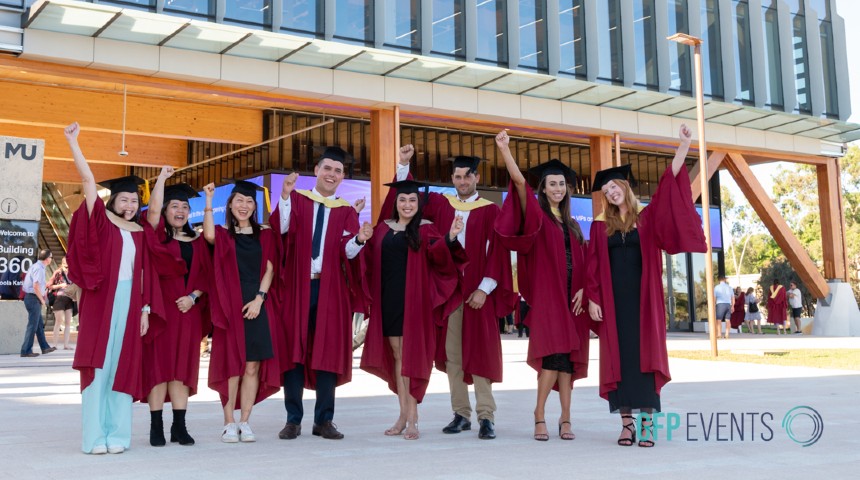 Graduates at the 2023 graduation ceremony in front of Boola Katitjin.