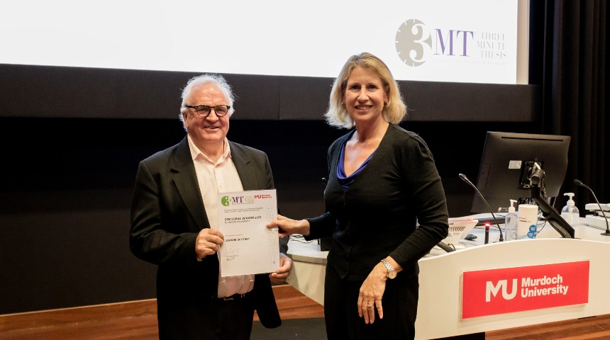 Professor Peter Davies presenting Joanne Scotney with her winning certificate at the 3MT competition held at Murdoch University