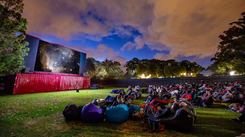 Guests on beanbags enjoy an evening movie at Murdoch's outdoor cinema