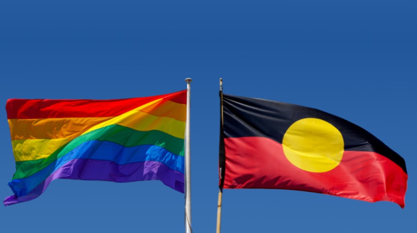 Pride flag and indigenous flag side by side