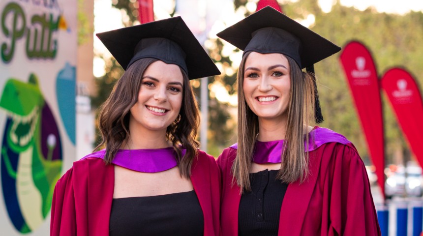 Two Murdoch graduates outside the arena before the ceremony 