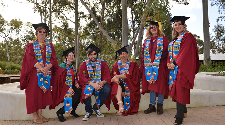 Aboriginal graduates don Indigenous sash