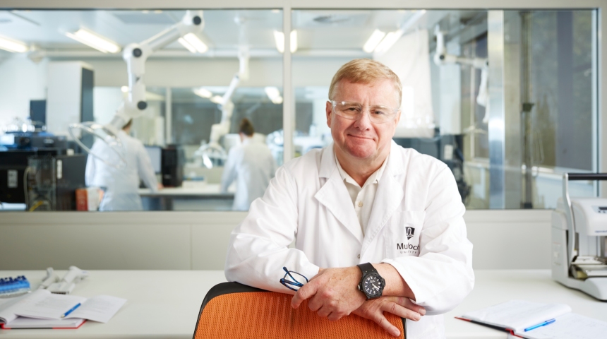 Jeremy Nicholson smiling in a lab coat at the Australian National Phenome Centre
