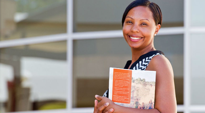 Smiling mature female student with brochure