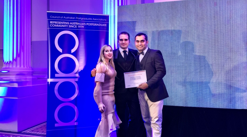Murdoch University Postgraduate Student Association executives accepting their award