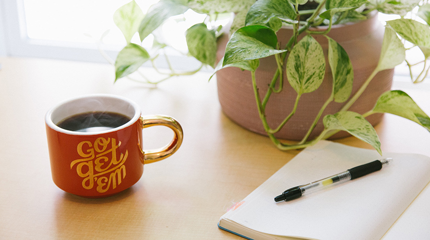 Coffee mug, notebook and pen 