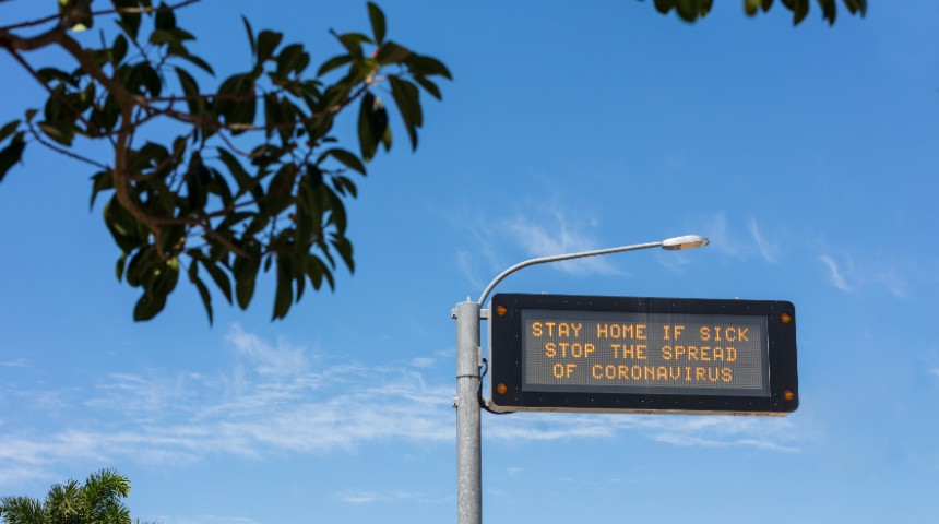 COVID-19 stay home warning road sign 