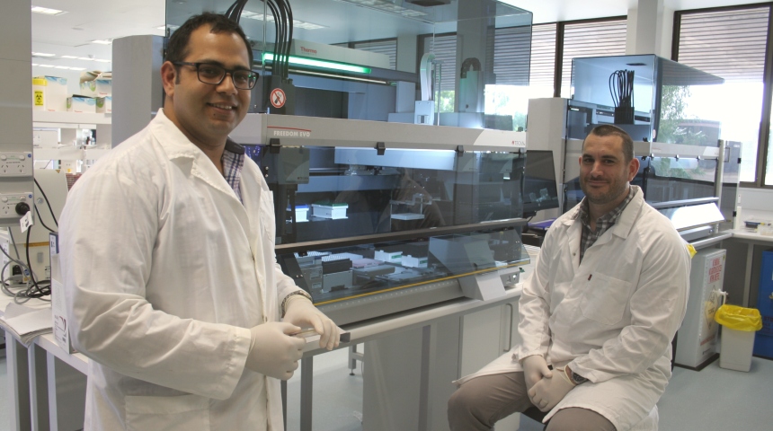 Associate Professor Sam Abraham and Dr Mark O’Dea standing near lab machinery