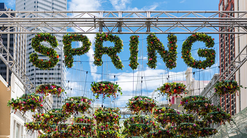 Hanging flowers that spell out spring under Perth buildings 