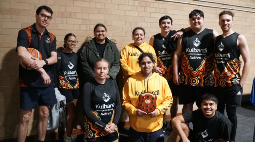 Kulbardi team together holding the state UniSport competition shield