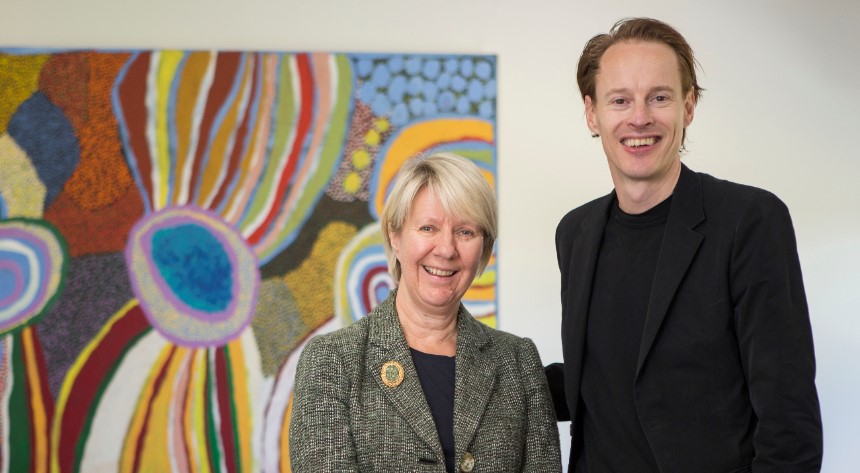 Vice Chancellor Eeva Leinonen with Daan Roosegaarde standing in front of a painting