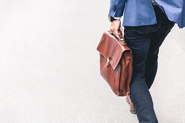 Man carrying briefcase on way to work